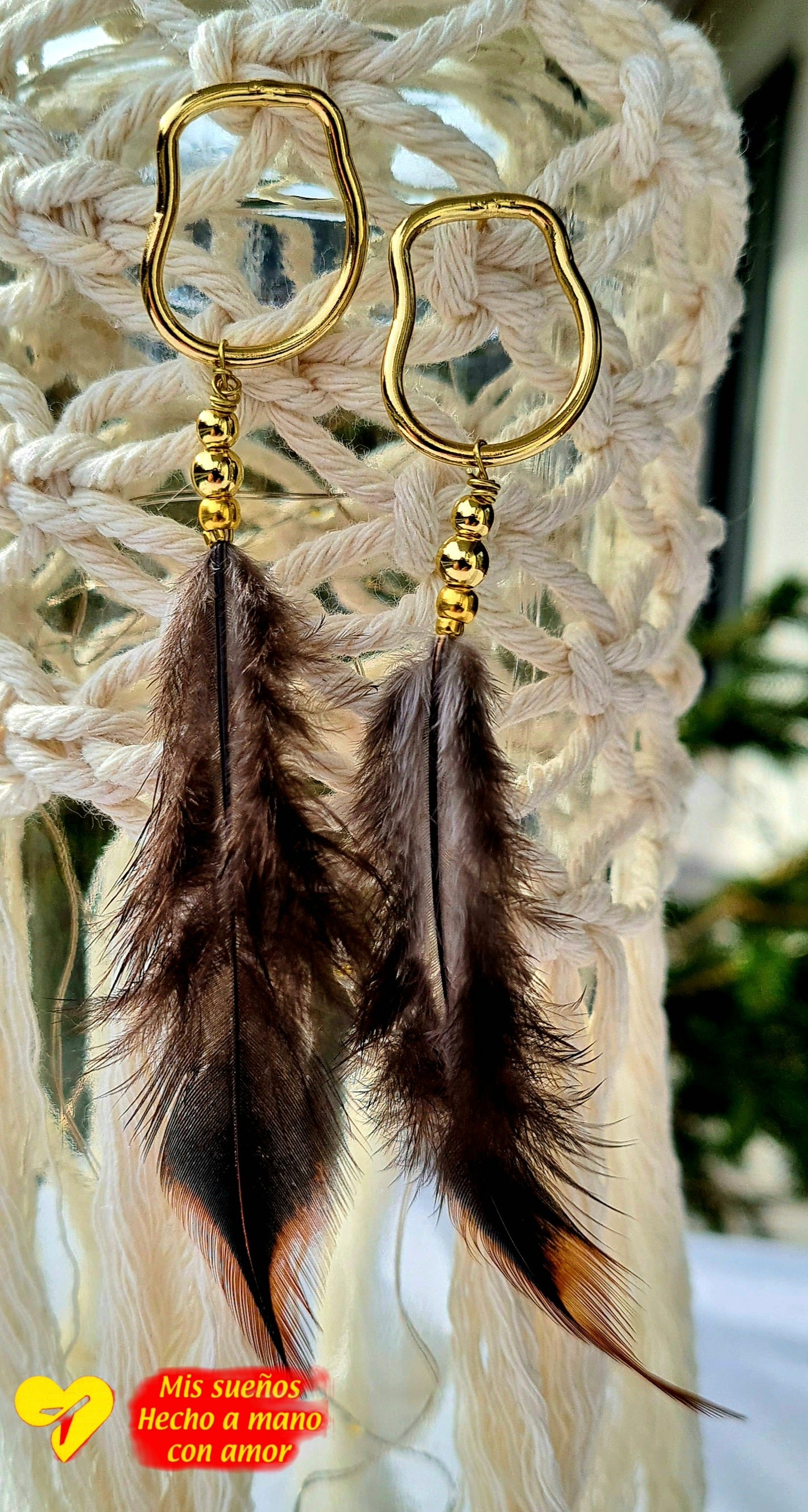 La pluma Ohrringe