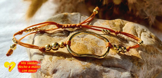 La pluma Armband
