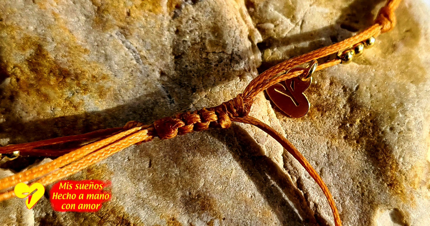 La pluma Armband